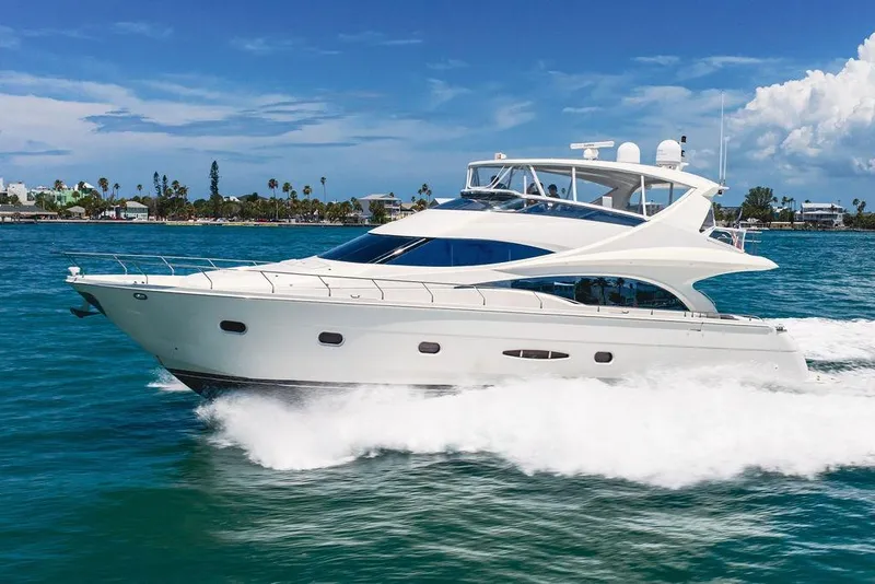 Slide: The Image of Luxurious 2005 Marquis 65 MY yacht cruising on clear blue waters. - 8