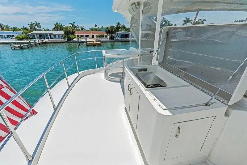Slide: The Image of Luxury 2005 Marquis 65 MY yacht deck with outdoor kitchen and scenic waterfront view. - 51