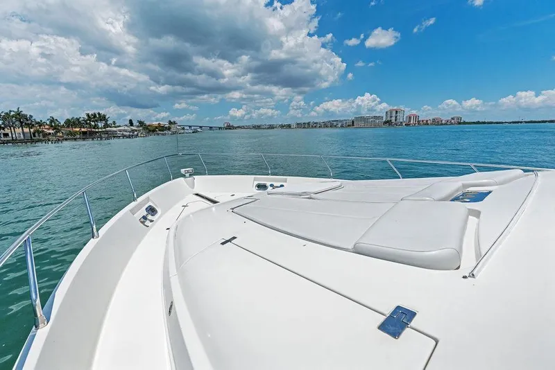 Slide: The Image of Luxurious 2005 Marquis 65 MY yacht cruising on a sunny day with scenic waterfront views. - 41