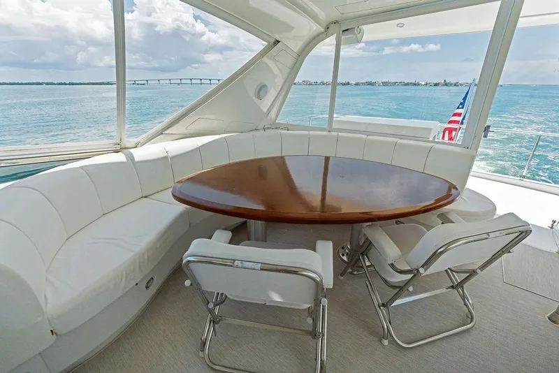 Slide: The Image of Luxurious 2005 Marquis 65 MY yacht interior with round table and ocean view. - 48