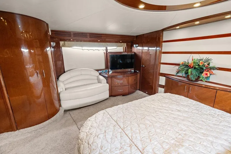 Slide: The Image of Luxurious interior of a 2005 Marquis 65 MY yacht with elegant wood finishes and modern amenities. - 35