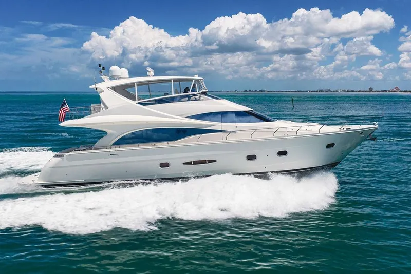 Slide: The Image of Luxurious 2005 Marquis 65 MY yacht cruising on clear blue ocean waters. - 11