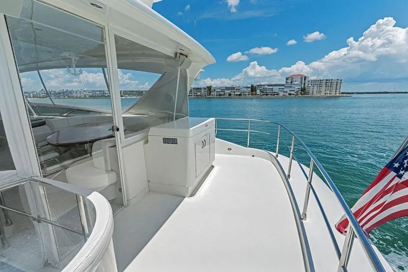 Slide: The Image of Luxurious 2005 Marquis 65 MY yacht deck with ocean view and American flag. - 50