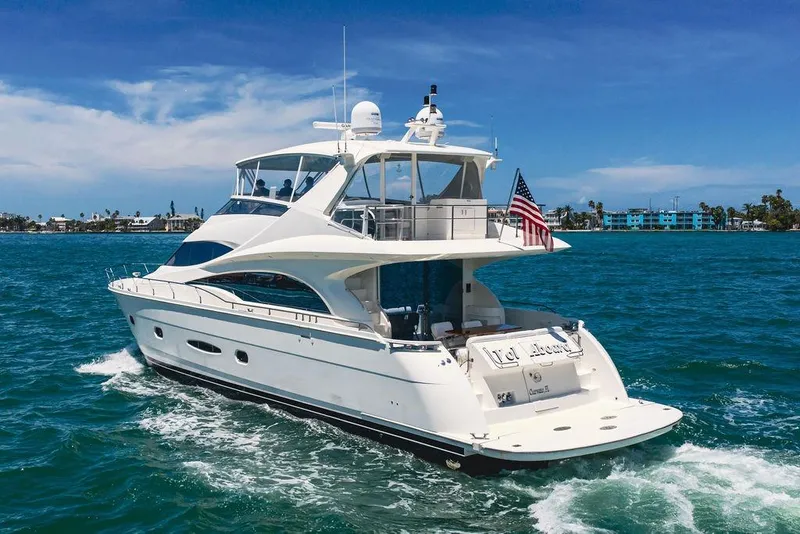 Slide: The Image of Luxurious 2005 Marquis 65 MY yacht cruising in clear blue waters. - 3