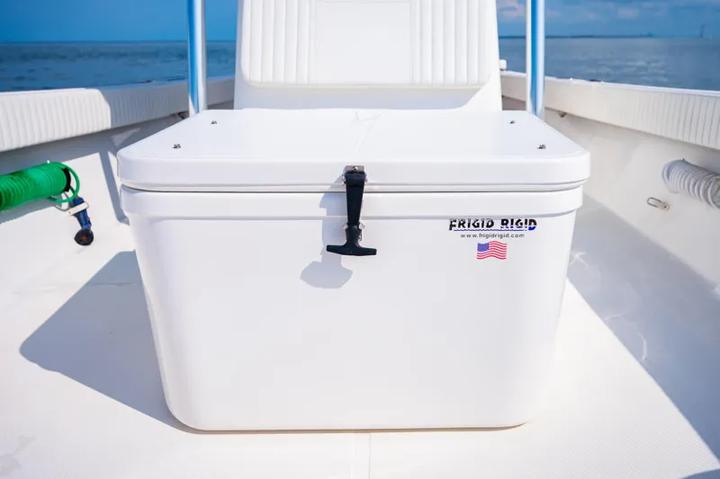 Slide: The Image of 2023 Canyon Bay 28h boat with Frigid Rigid cooler on deck, ocean background. - 27