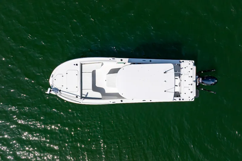 Slide: The Image of Aerial view of 2023 Canyon Bay 28h boat on green water. - 3