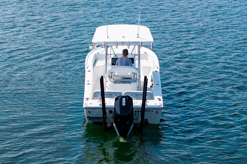 Slide: The Image of 2023 Canyon Bay 28h boat on open water, rear view with outboard motor. - 7