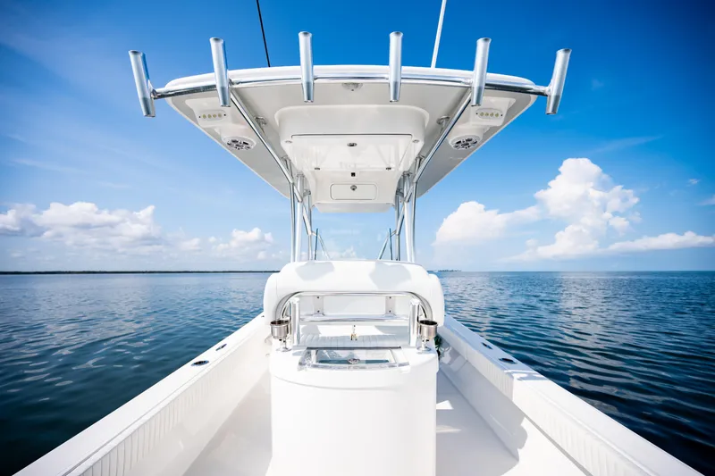 Slide: The Image of 2023 Canyon Bay 28h boat on calm ocean under clear blue sky. - 54
