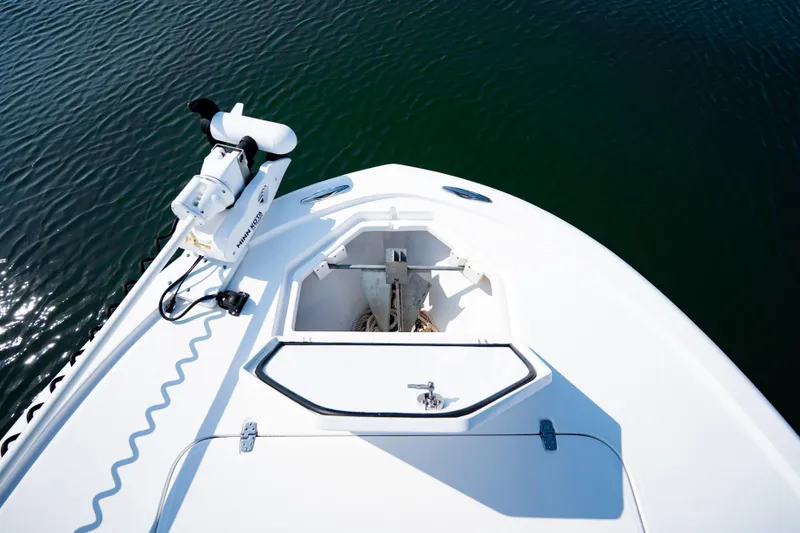 Slide: The Image of Bow view of 2023 Canyon Bay 28h boat with anchor compartment open. - 13