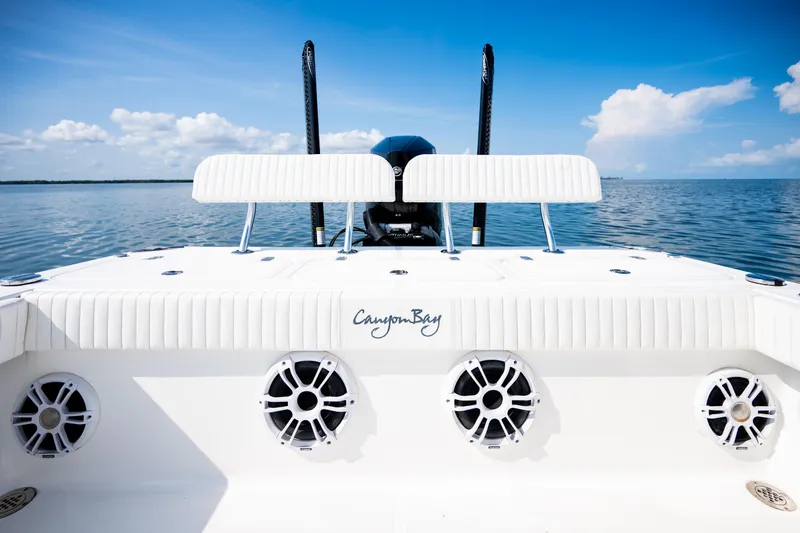 Slide: The Image of 2023 Canyon Bay 28h boat on calm water, featuring sleek design and modern amenities. - 45