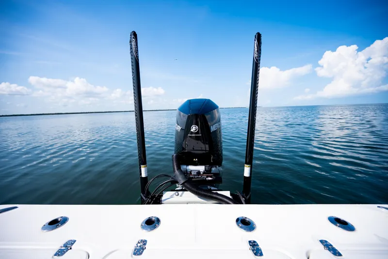 Slide: The Image of 2023 Canyon Bay 28h boat with Mercury engine on calm ocean waters. - 49
