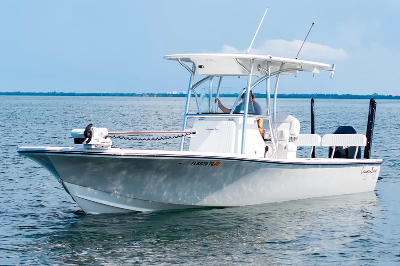 The Image of 2023 Canyon Bay 28h boat cruising on open water under clear skies. - 0