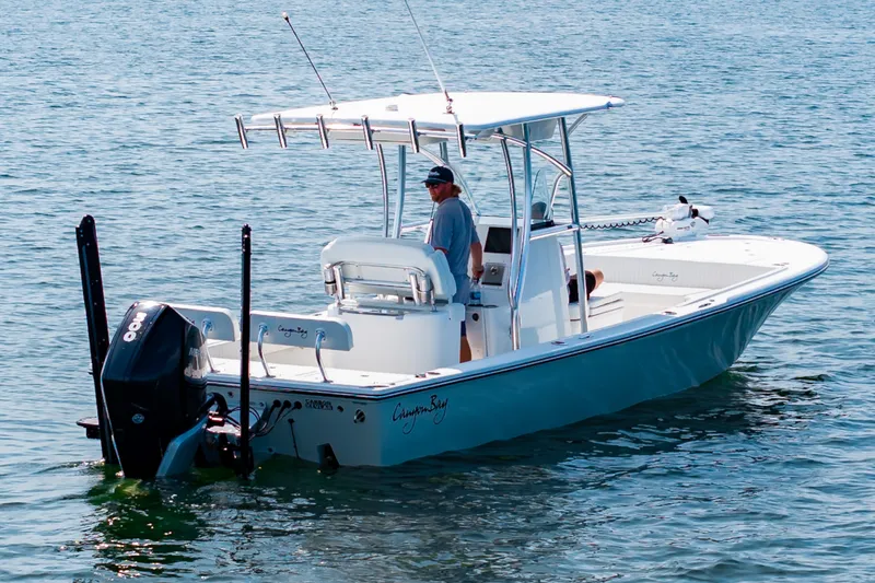Slide: The Image of 2023 Canyon Bay 28h boat on water, featuring sleek design and powerful outboard motor. - 6
