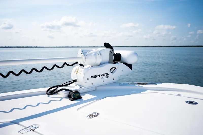 Slide: The Image of 2023 Canyon Bay 28h boat with Minn Kota Ulterra motor on calm water. - 12