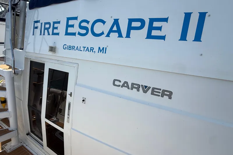 Slide: The Image of 1996 Carver 400 Cockpit Motor Yacht, "Fire Escape II," Gibraltar, MI, side view. - 14