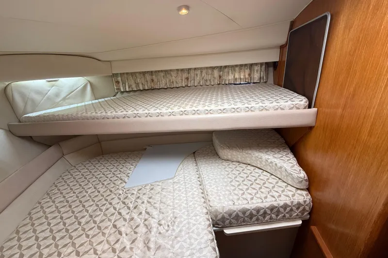 Slide: The Image of Interior cabin of 1996 Carver 400 Cockpit Motor Yacht with bunk beds. - 38