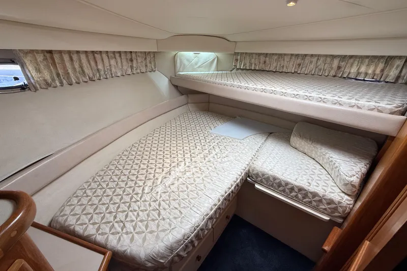 Slide: The Image of Interior cabin of 1996 Carver 400 Cockpit Motor Yacht with cozy bedding. - 39