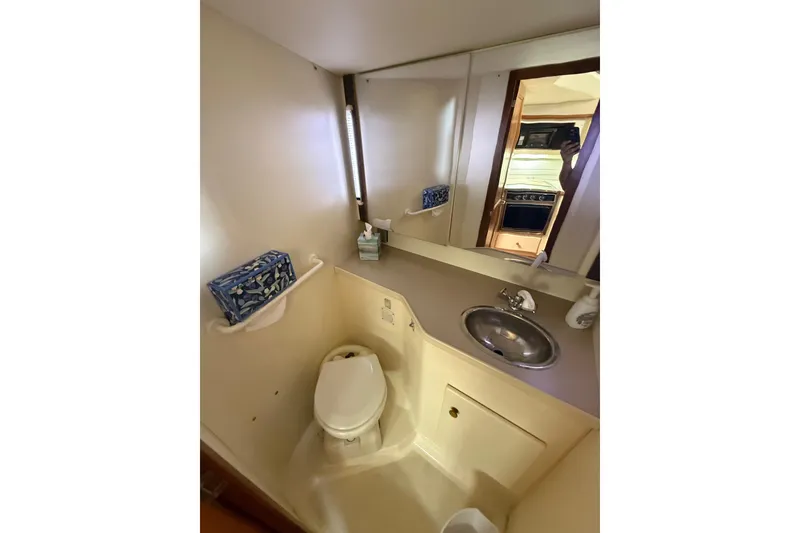 Slide: The Image of Bathroom interior of 1996 Carver 400 Cockpit Motor Yacht with sink and toilet. - 40