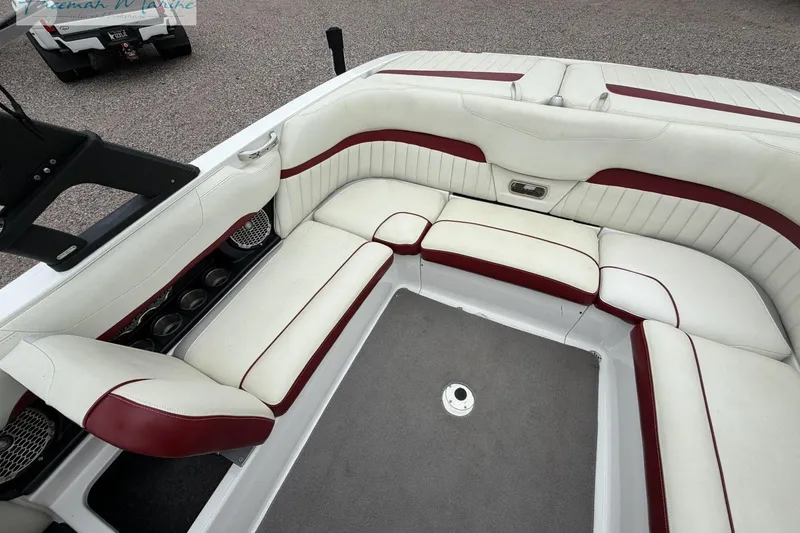 Slide: The Image of 2014 Malibu Wakesetter 24 MXZ interior with white and red seating. - 16