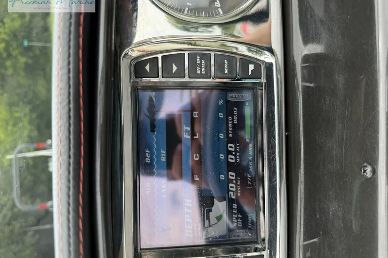 Slide: The Image of Dashboard display of a 2014 Malibu Wakesetter 24 MXZ boat, showing various controls and settings. - 34