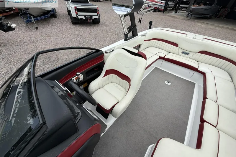Slide: The Image of 2014 Malibu Wakesetter 24 MXZ boat interior with white and red seating. - 14