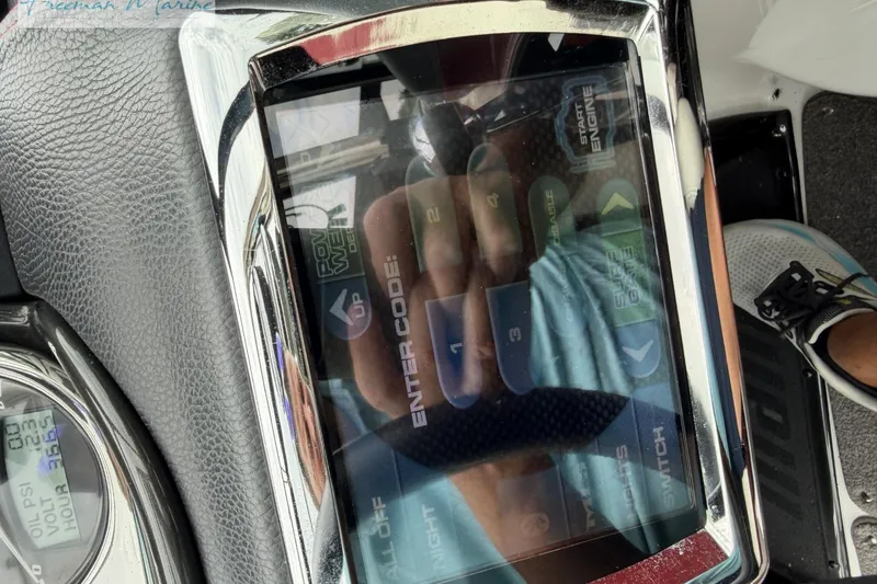 Slide: The Image of Touchscreen control panel of a 2014 Malibu Wakesetter 24 MXZ boat. - 36