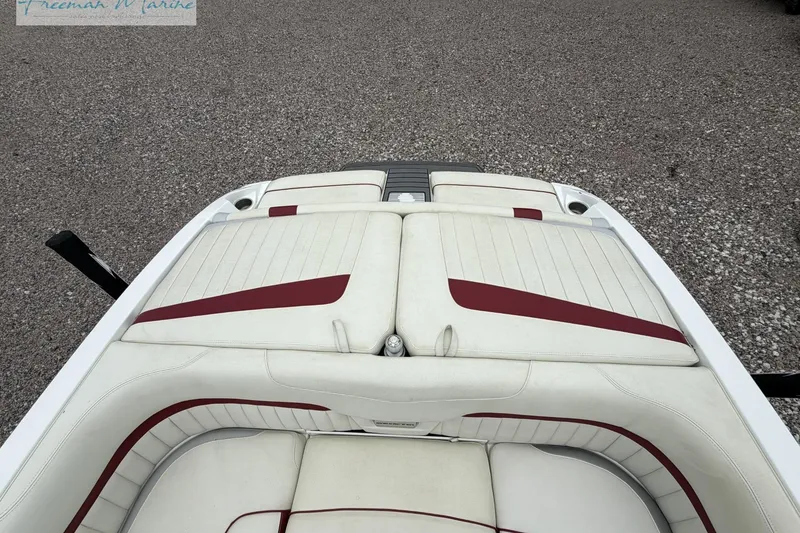 Slide: The Image of 2014 Malibu Wakesetter 24 MXZ boat interior with white and red upholstery. - 18