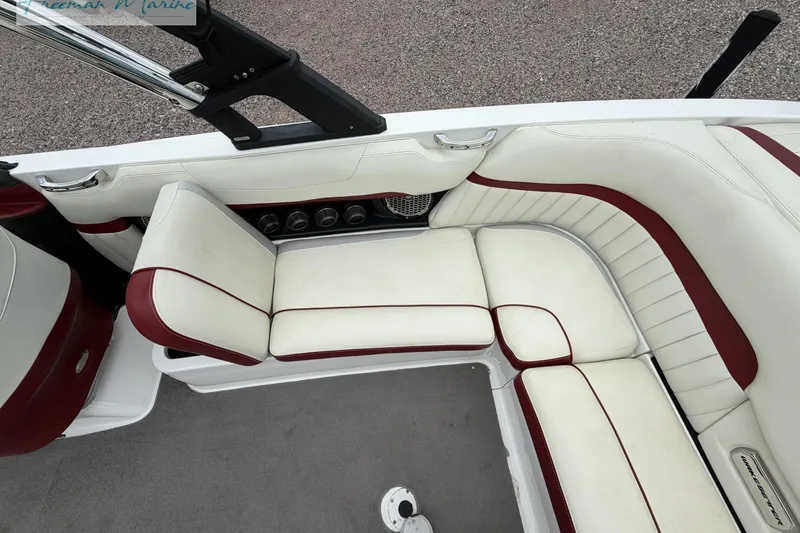 Slide: The Image of 2014 Malibu Wakesetter 24 MXZ interior with white and red seating. - 19