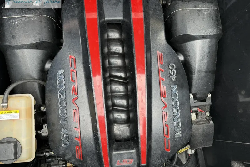 Slide: The Image of Engine of a 2014 Malibu Wakesetter 24 MXZ with Corvette Monsoon 450 branding. - 27