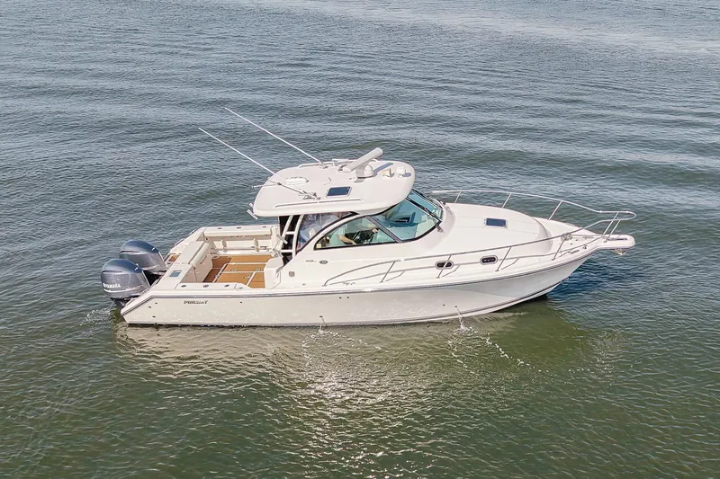 The Image of 2013 Pursuit OS 345 Offshore boat cruising on open water. - 0
