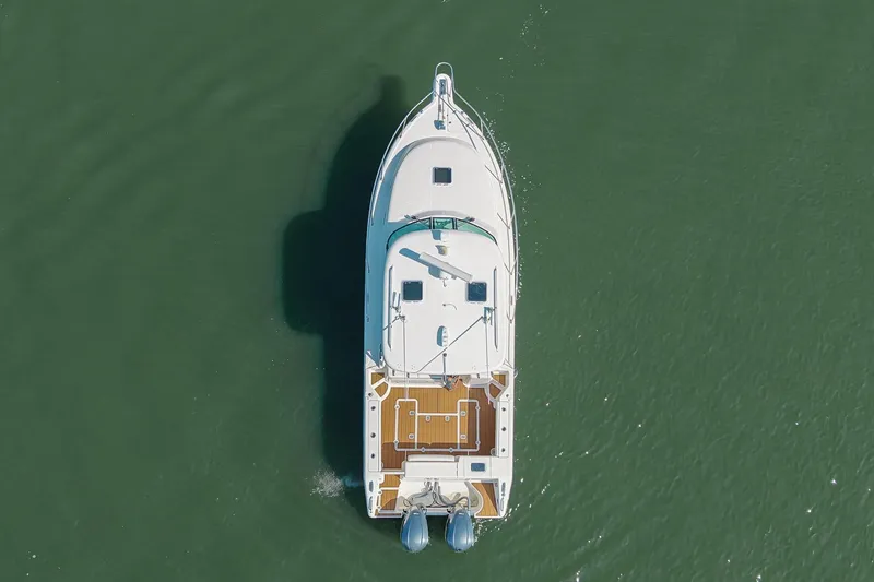 Slide: The Image of Overhead view of 2013 Pursuit OS 345 Offshore boat on calm water. - 1