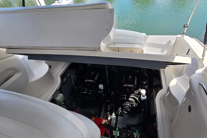 Slide: The Image of Engine compartment of a 2002 Sea Ray 300 Sundancer boat, open for maintenance. - 38