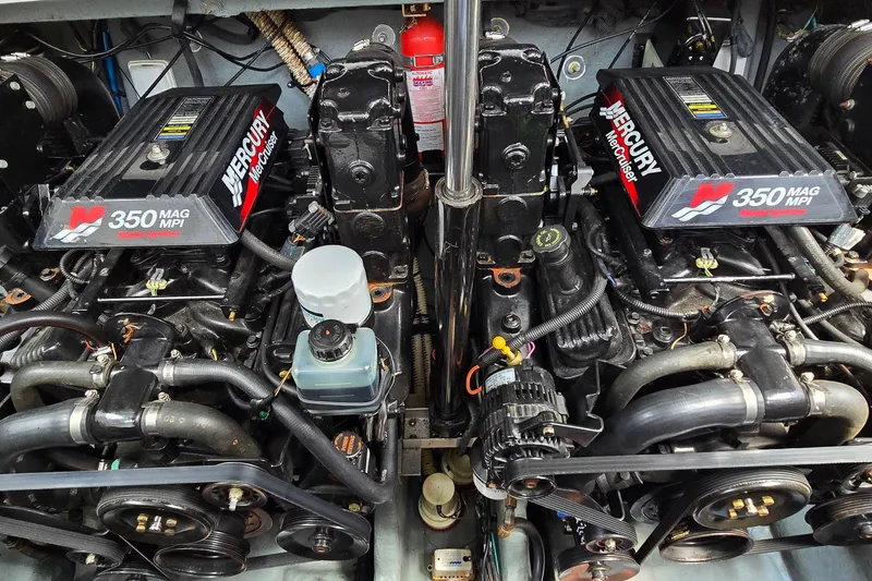 Slide: The Image of Twin Mercury 350 MAG MPI engines in a 2002 Sea Ray 300 Sundancer boat. - 37