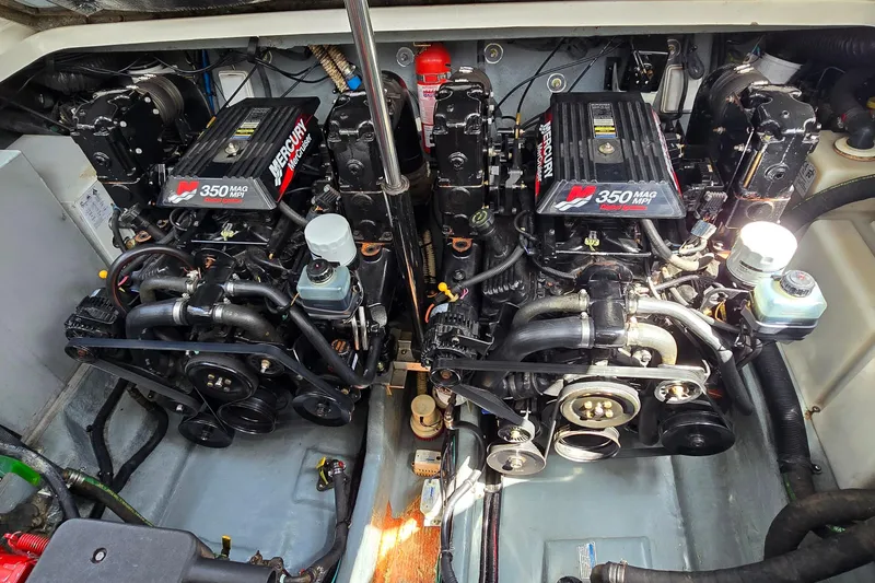 Slide: The Image of Engine compartment of a 2002 Sea Ray 300 Sundancer with twin Mercury 350 MAG MPI engines. - 31