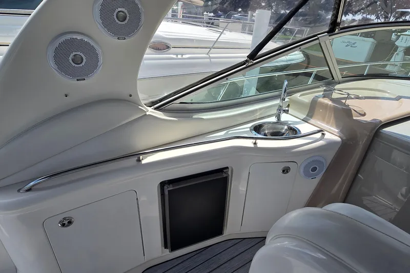 Slide: The Image of Interior of 2002 Sea Ray 300 Sundancer yacht with sink and speakers. - 11