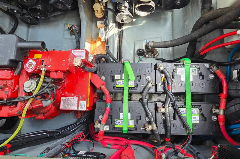 Slide: The Image of Engine compartment of a 2002 Sea Ray 300 Sundancer with batteries and wiring. - 32