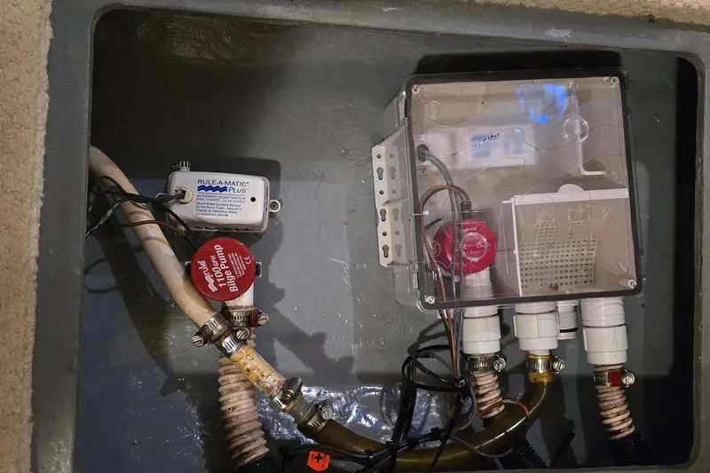 Slide: The Image of Bilge pump system in 2002 Sea Ray 300 Sundancer boat, featuring Rule-A-Matic Plus switch. - 30