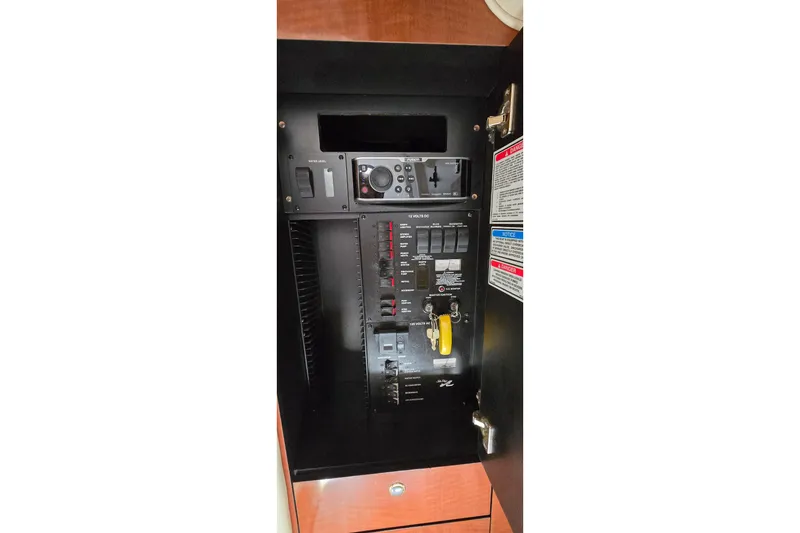 Slide: The Image of Electrical control panel of a 2002 Sea Ray 300 Sundancer boat. - 23