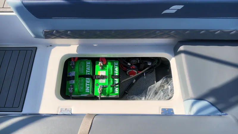 Slide: The Image of Battery compartment of a Starcraft SVX 211 OB boat with green batteries. - 12