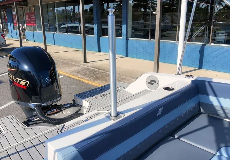 Slide: The Image of The image shows the stern of a Starcraft SVX 211 OB with an outboard motor. - 7