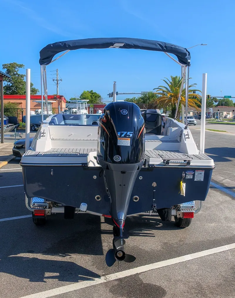 Slide: The Image of The image shows a 2027 Starcraft SVX 211 OB boat with an outboard motor. - 3