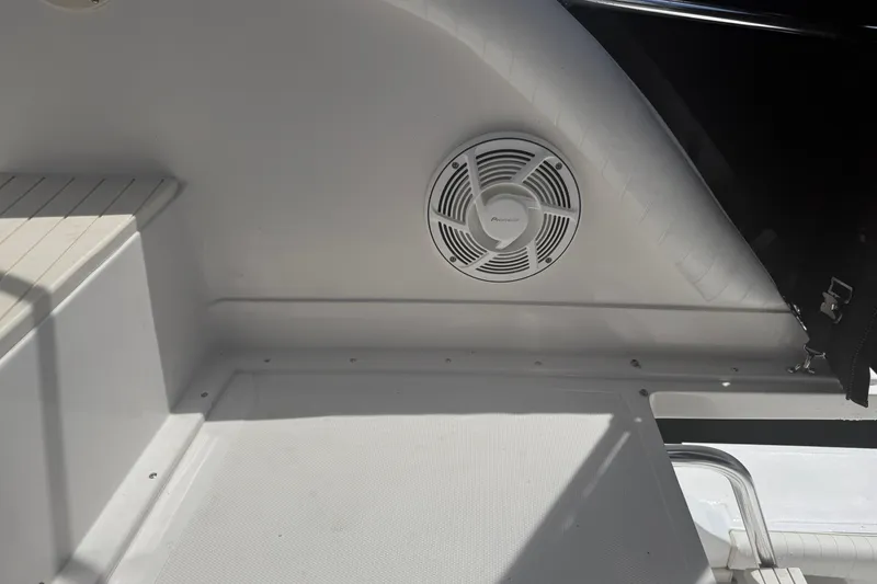 Slide: The Image of Interior of 1999 Blackfin 33 Flybridge with Pioneer speaker and seating area. - 31
