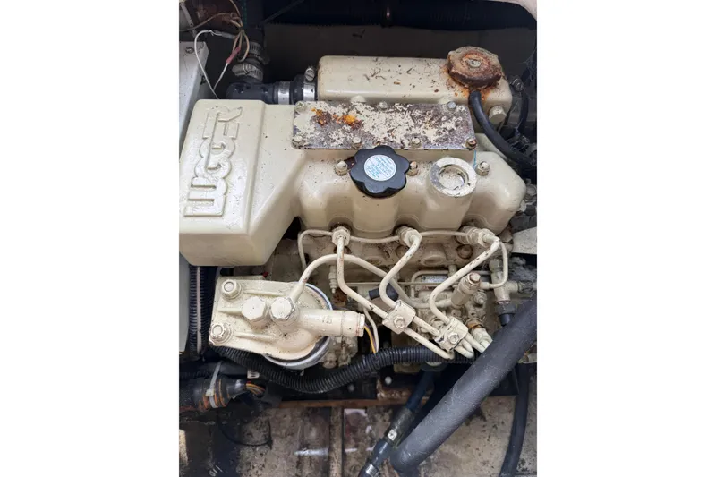 Slide: The Image of Engine of a 1999 Blackfin 33 Flybridge boat, showing mechanical components. - 67