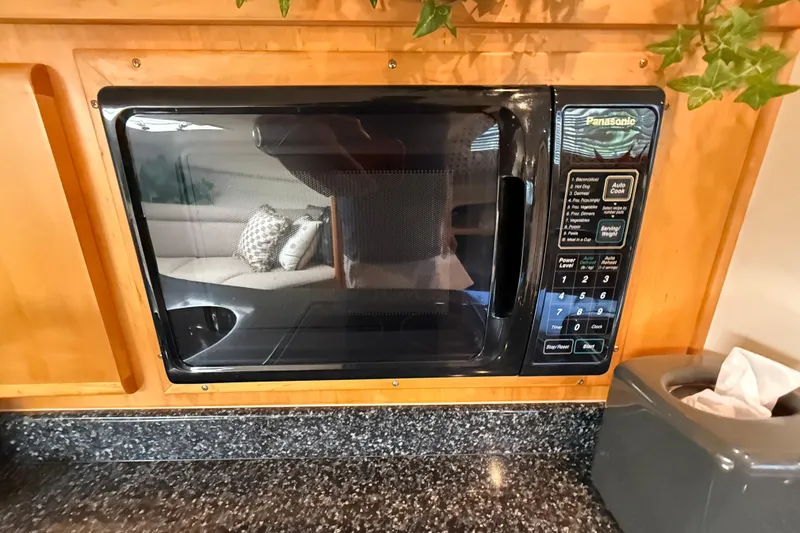 Slide: The Image of Built-in Panasonic microwave in 1999 Blackfin 33 Flybridge yacht kitchen. - 44
