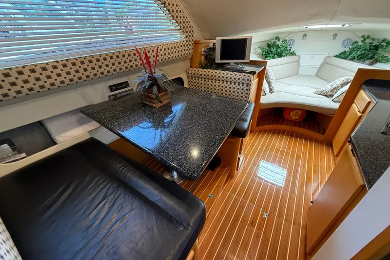 Slide: The Image of Luxurious interior of 1999 Blackfin 33 Flybridge yacht with elegant seating and modern amenities. - 33