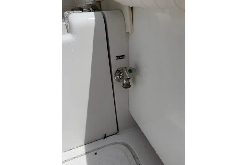 Slide: The Image of Water outlet on 1999 Blackfin 33 Flybridge boat interior. - 32