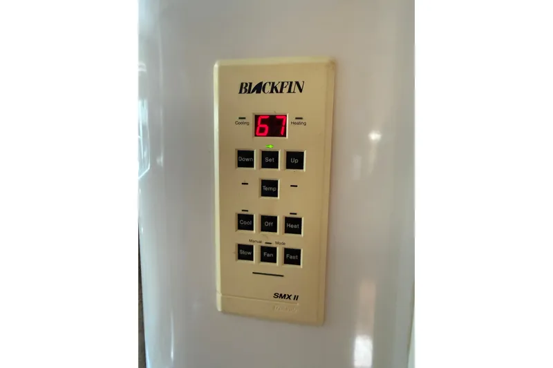 Slide: The Image of Control panel of a 1999 Blackfin 33 Flybridge boat, displaying temperature settings. - 55