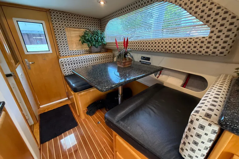 Slide: The Image of Interior of 1999 Blackfin 33 Flybridge with elegant dining area and modern decor. - 37