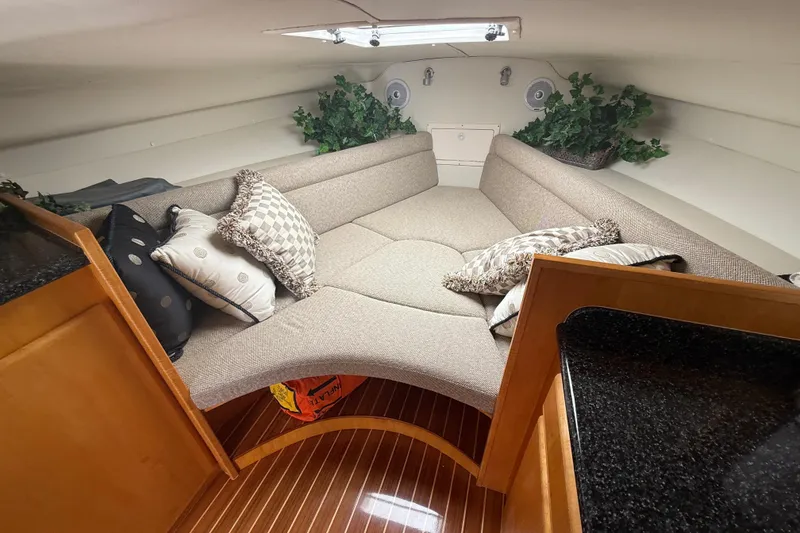 Slide: The Image of Luxurious interior of 1999 Blackfin 33 Flybridge with cozy seating and decorative pillows. - 48