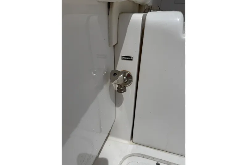 Slide: The Image of Stainless steel latch on 1999 Blackfin 33 Flybridge boat interior. - 30
